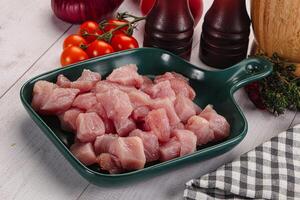 Diced raw turkey fillet cubes photo