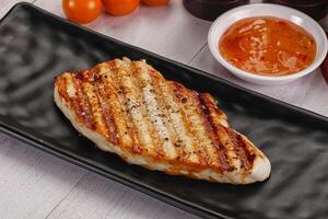 Grilled turkey fillet steak with sauce photo