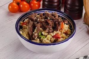 Traditional couscous with beef and vegetables photo