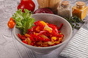 Diced raw bell red and yellow pepper photo