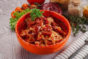 Italian pasta with dry tomato photo