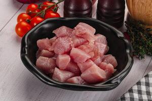 Diced raw turkey fillet cubes photo