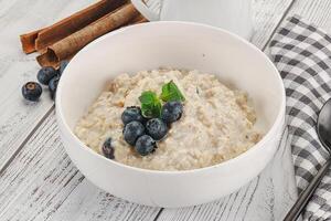 Oats porridge with blueberry photo
