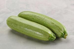 Raw green ripe zucchini vegetable photo