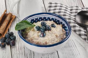 Oats porridge with blueberry photo