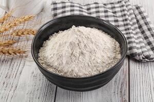 Wheat flour heap for bake photo