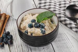 Oats porridge with blueberry photo