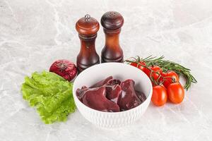 Raw turkey liver in a bowl ready for cooking photo