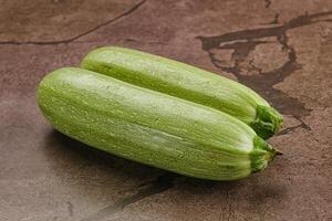 Raw green ripe zucchini vegetable photo