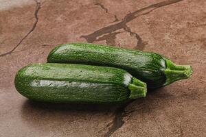 Raw green ripe zucchini vegetable photo