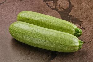 Raw green ripe zucchini vegetable photo