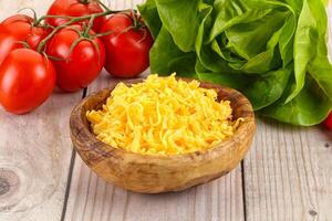 Shredded cheese in the bowl photo