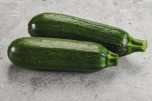 Raw green ripe zucchini vegetable photo