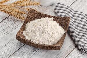 Wheat flour heap for bake photo