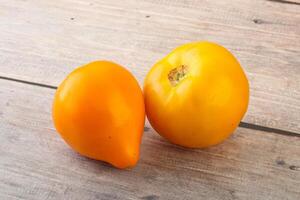 Ripe yellow bright juicy tomato photo