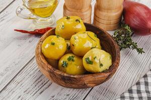 Hot boiled baby potato with oil photo