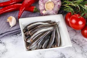 Pickled anchovy in the plate photo