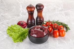 Raw turkey liver in a bowl ready for cooking photo