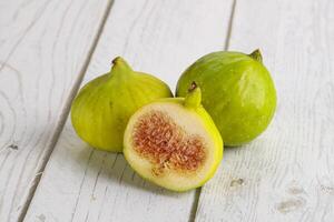 Ripe sweet juicy green fig heap photo