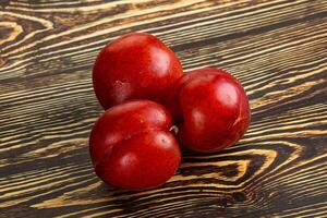 Ripe sweet juicy red plum photo