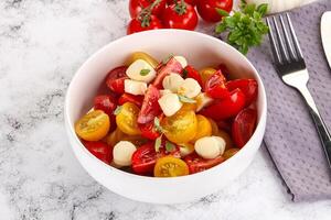 Italian Caprese salad with tomato and mozzarella photo