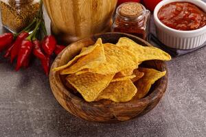 Mexican corn nachos chips with salsa photo