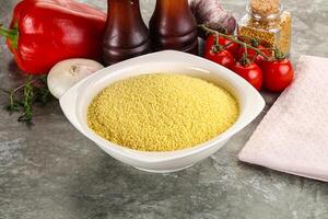 Raw dry wheat couscous grain photo