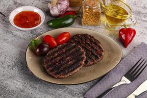 Grilled burger cutlet with sauce photo