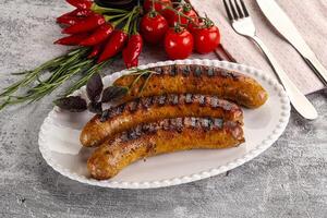 Grilled meat sausages with spices photo