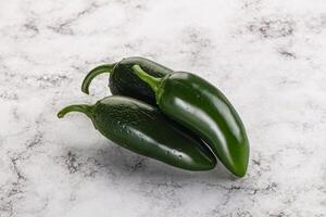 Raw green Mexican jalapeno pepper photo