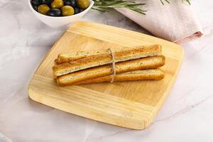 Crispy grissini italian bread heap photo