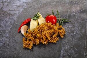 Raw whole grain pasta fusilli photo