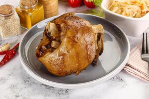 Baked pork knee with spices photo