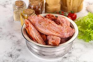 Marinated Duck wings for barbecue photo