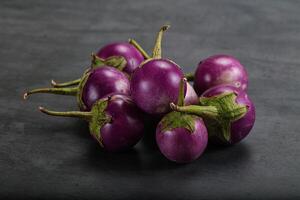 Raw small purple asian baby eggplant photo