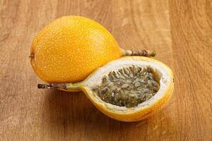 Yellow granadilla with cut half photo