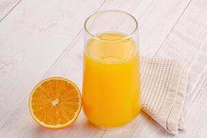 Sweet fresh orange juice in the glass photo