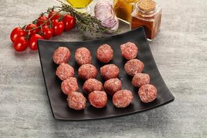 Uncooked raw beef meatball minced photo