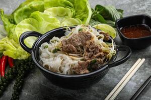 Vietnamese traditional soup Pho Bo with beef photo