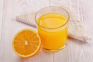 Sweet fresh orange juice in the glass photo