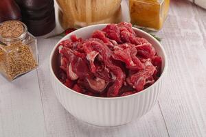 Raw beef meat - sliced strips photo