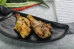 Chicken leg tikka with spices photo