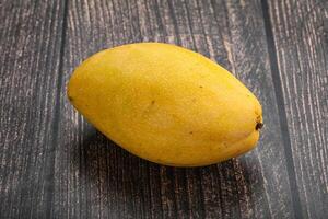 Sweet ripe juicy tropical mango fruit photo