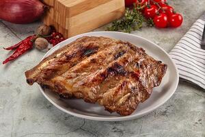 Grilled pork ribs with spices photo