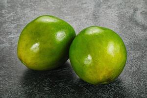 Two ripe green exotic avocado fruit photo