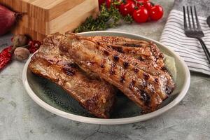 Grilled pork ribs with spices photo