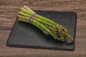 Vegan cuisine - Raw asparagus heap photo