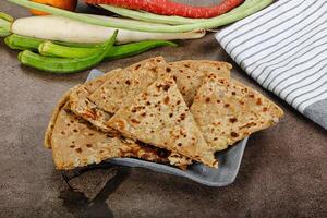 Indian Aloo Paratha - bread with potato photo