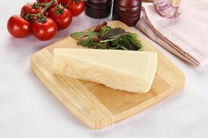 Piece Italian hard parmesan cheese photo