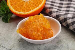 Tasty homemade Orange jam in the bowl photo